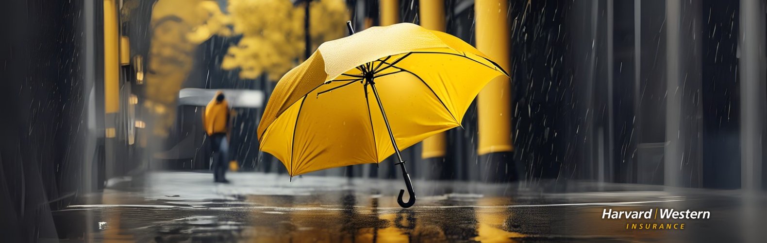Yellow umbrella in a rainy street